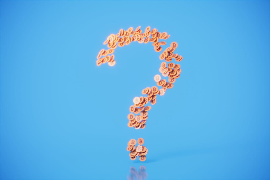 Photo illustration of coins forming a question mark