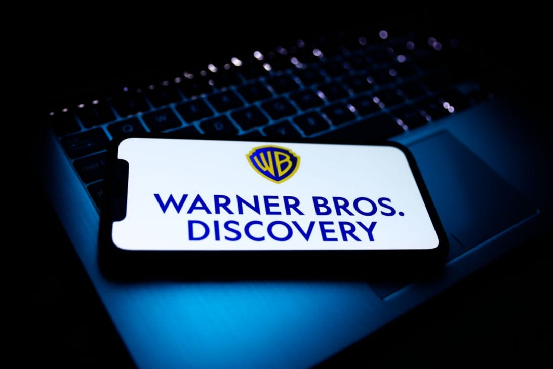 Warner Bros. Discovery logo on a smartphone screen
