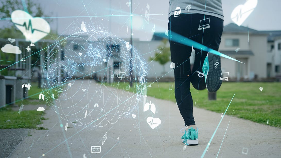 A person running down a sidewalk away from the camera, overlaid with graphics depicting health and fitness
