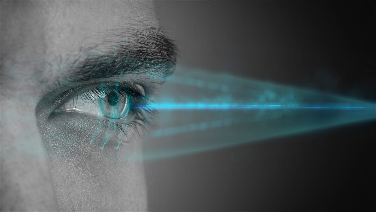 Closeup of an eye being scanned by a retina scanner.