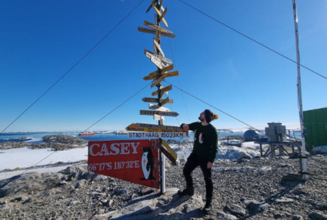 Dr. Jackson Ryan doing on-the-ground reporting in Antarctica.