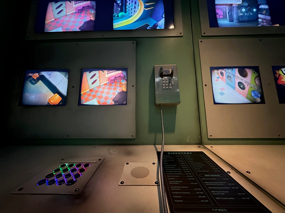 A phone amid observation monitors in a dim room