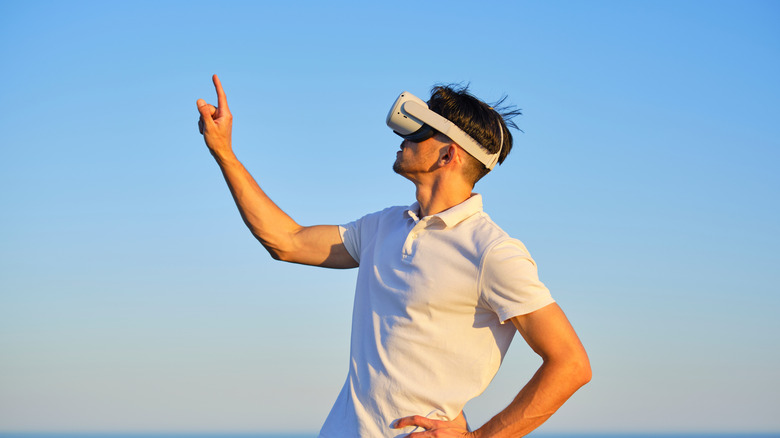 man exploring VR using a VR headset outdoors